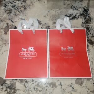Coach 2 small paper gift bags